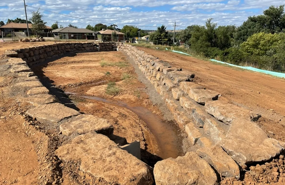 Rock retaining wall construction site