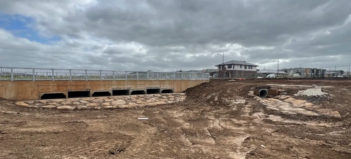 Construction site with bridge and cloudy sky